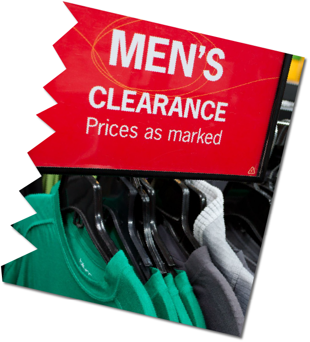 large red sign with white writing saying  'Men's Clearance Prices as marked.  Underneath, hangers with men's tops on them